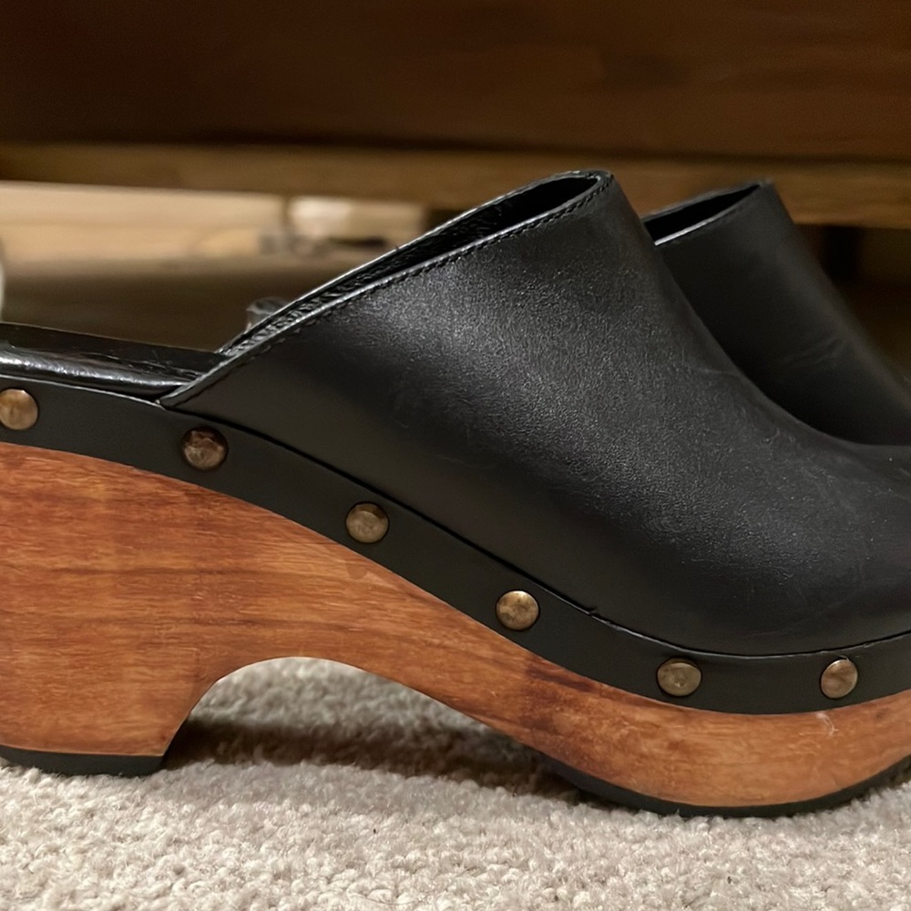 Black pair of clogs - brand is a Cordani